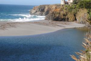 Ocean waves flowing over the sandbar by Jeanne Jackson (Large)