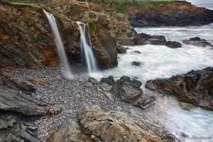 Waterfalls and a stormy sea by Craig Tooley