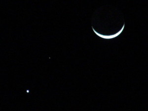 Astronomical Trio - Venus, Mars, and the crescent moon by Larry Riddle