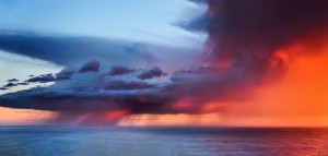 Rain over the ocean lit by the sunset 2.28.14 by Paul Kozal