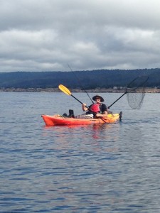 Hal Ferguson fishing from a kayak by Catherine Miller