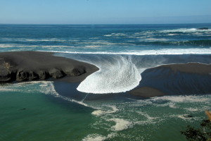 Big surf flowing over the sandbar of the Gualala River by Bob Rutemoeller