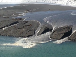 The Pacific Ocean washes over the sandbar at the Gualala River by Jackie Gardner