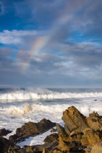 Big waves and rainbows by Craig Tooley