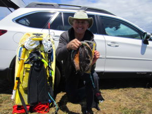 Roger Rude finds a trophy Abalone by Jack Likins